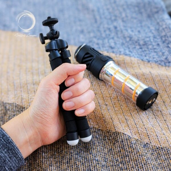Hand holding extended Fleximount tripod beside Silent Lantern