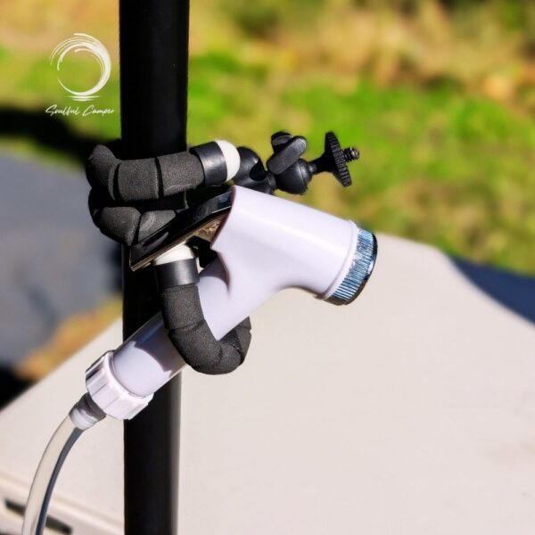 Fleximount wrapped around pole holding a shower nozzle