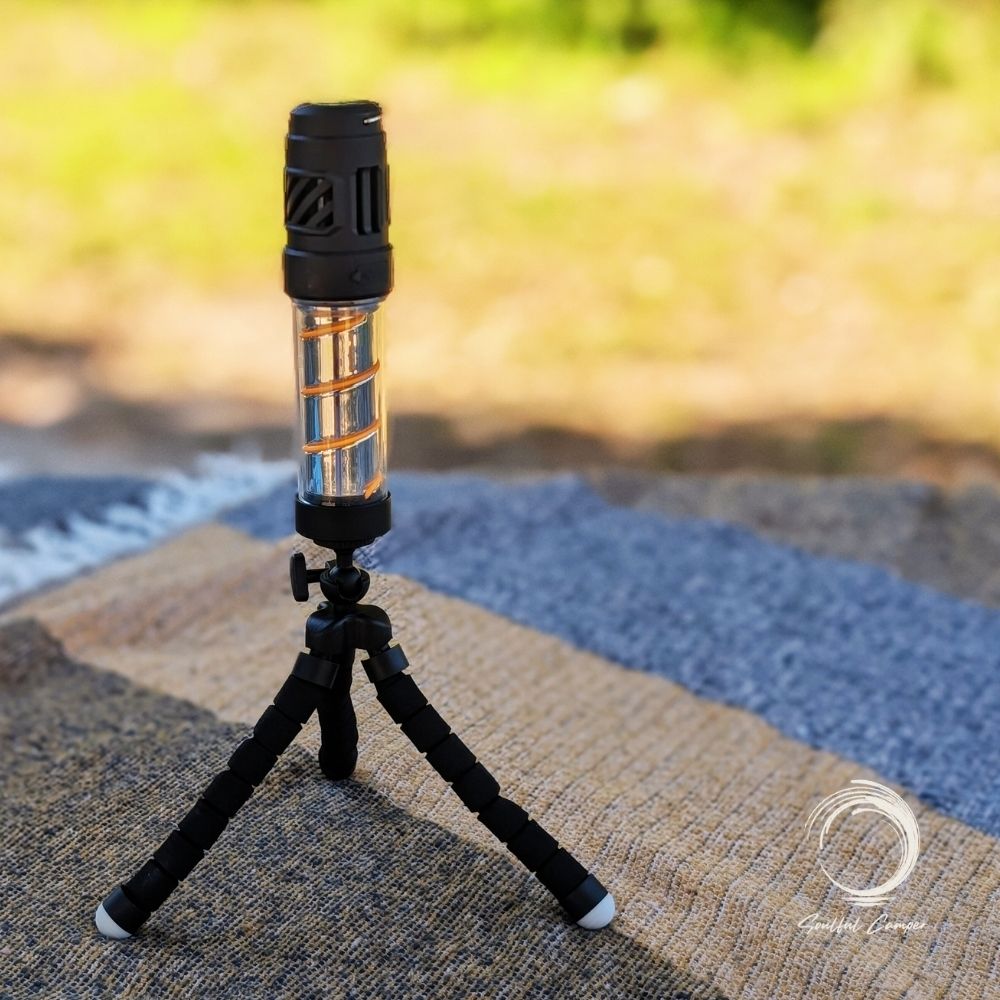 Fleximount tripod standing upright on a picnic blanket holding Silent Lantern
