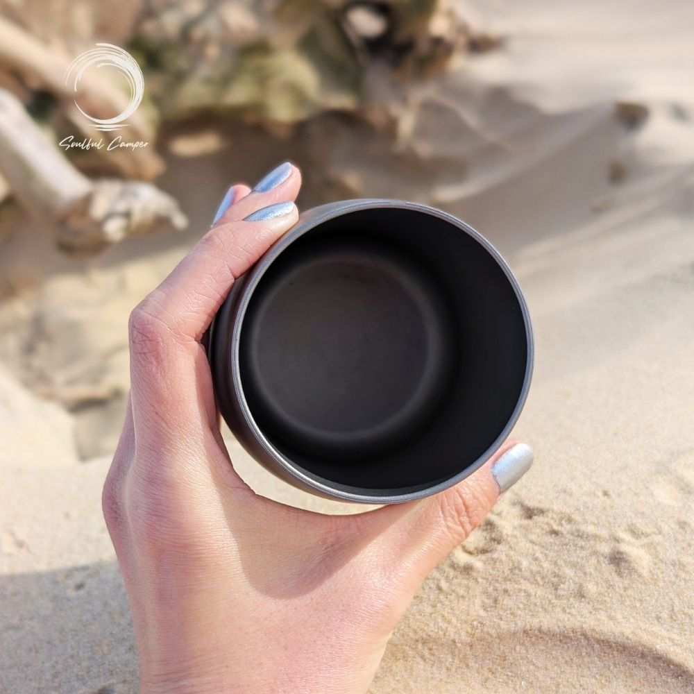 op view of titanium camping cup showing clean interior and seamless construction.